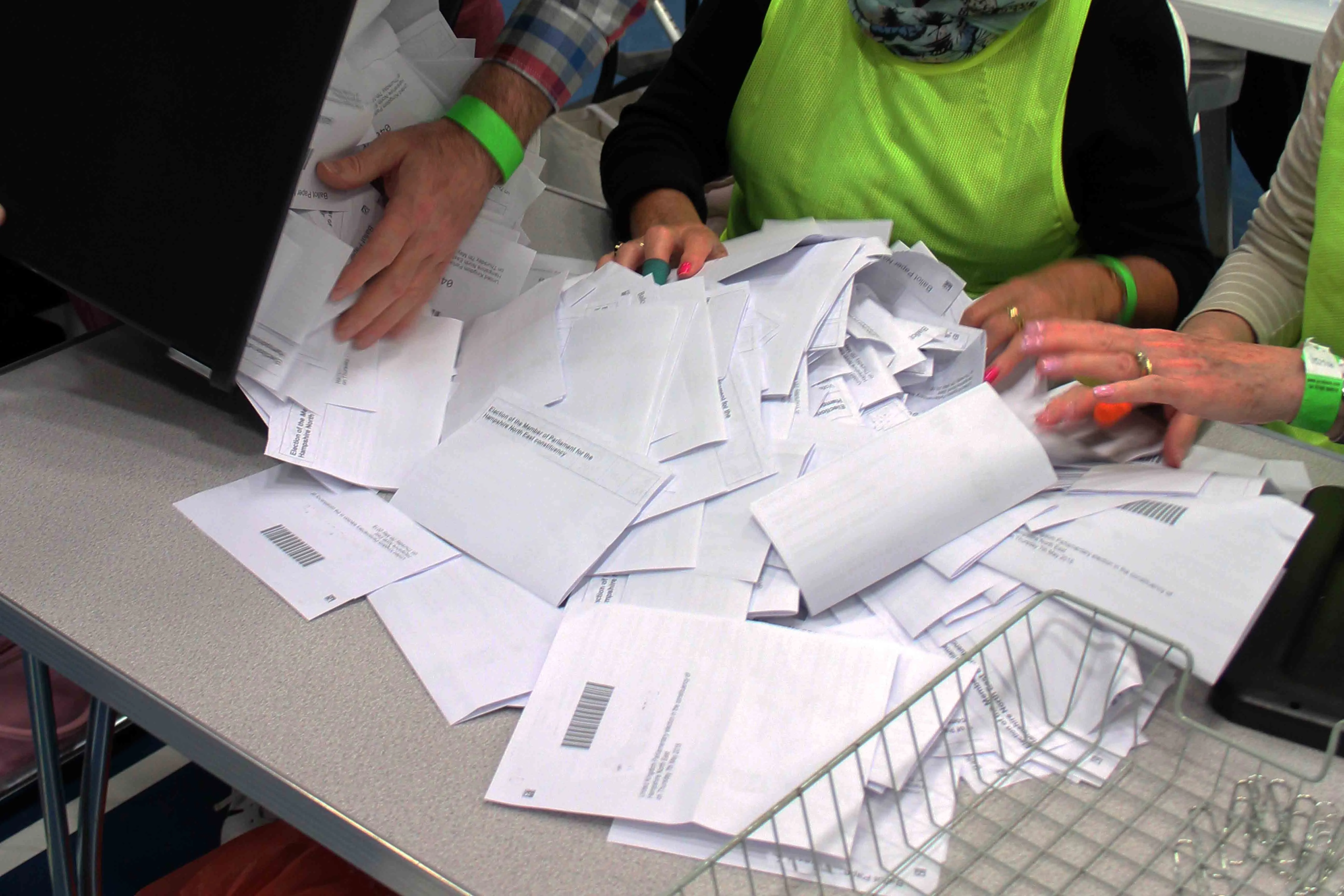 A ballot box tippling out voter slips