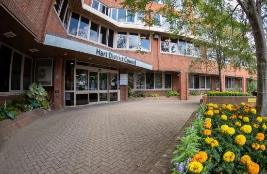 Hart District Council office entrance with orange and yellow flowers in foreground