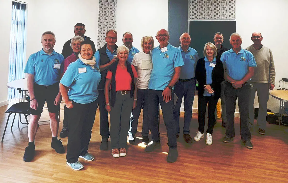 Repair Cafe team standing in a hall