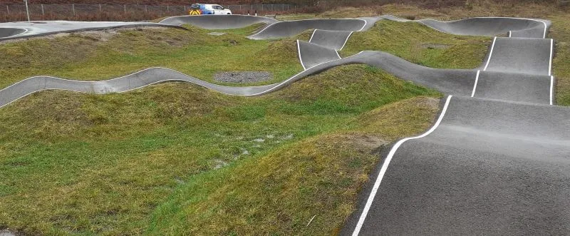 Series of bike tracks with grass in between